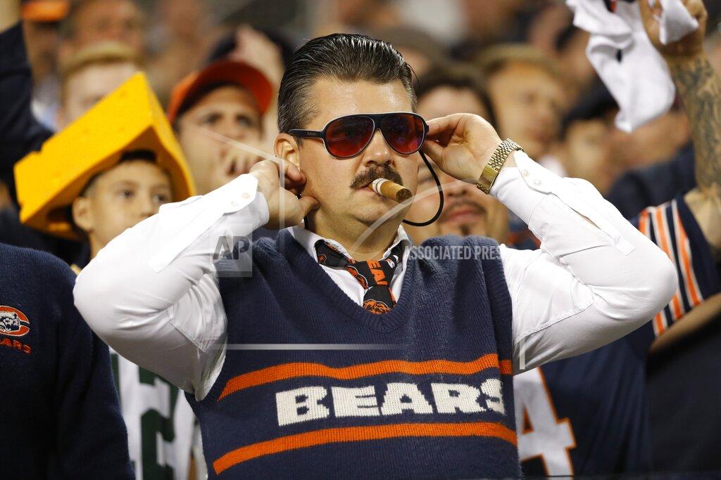 Charles Rex Arbogast A fan watches during the first half of an NFL football game between the Green Bay Packers and the Chicago Bears Thursday, Sept. 5, 2019, in Chicago. (AP Photo/Charles Rex Arbogast)