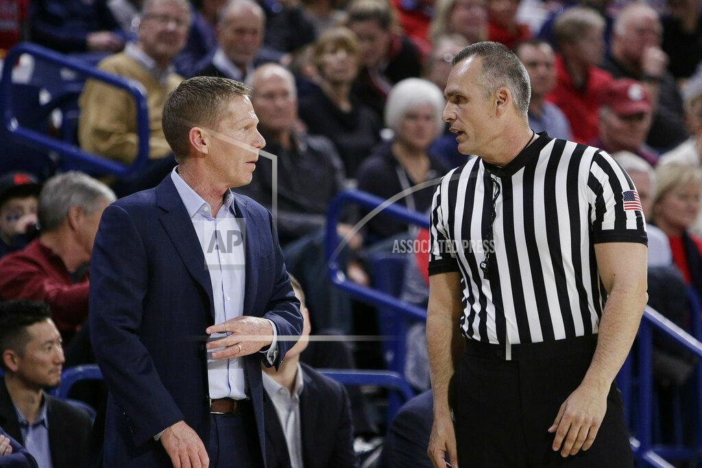 Young Kwak Gonzaga coach Mark Few, left, speaks with an official during the first half of the team's NCAA college basketball game against Loyola Marymount in Spokane, Wash., Thursday, Jan. 17, 2019. (AP Photo/Young Kwak)