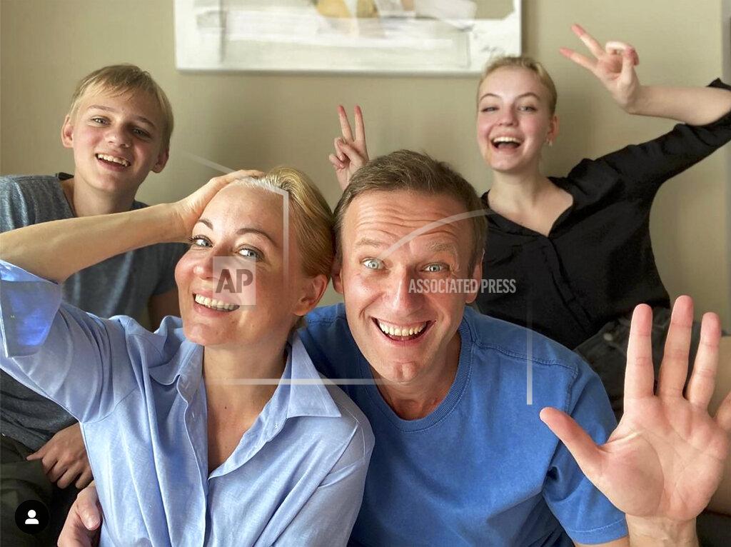 Uncredited FILE - In this frame from video released on Dec. 31, 2020 by Russian opposition activist Alexei Navalny on his Instagram account, Navalny, foreground right, his wife Yulia, foreground left, his daughter Daria, right, and son Zakhar pose for a selfie. The return of Navalny from Germany on Jan. 17, 2021, after he spent five months in Berlin recovering from a nerve agent poisoning was marked by chaos and popular outrage, and it ended, almost predictably with his arrest. The flight carried him and his wife, along with a group of journalists documenting the journey. (Navalny Instagram account via AP, File)