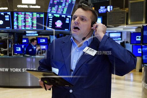 Trader Michael Milano works on the floor of the New York Stock Exchange, Monday, Nov. 29, 2021. Stock indexes are edging higher on Wall Street Monday as markets regain their footing following a big stumble on Friday on worries about the spread of the new variant of the coronavirus. (AP Photo/Richard Drew)