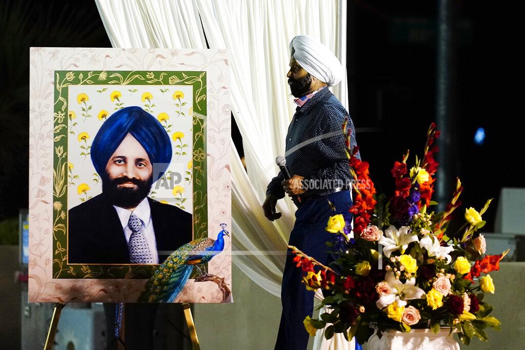 Ross D. Franklin Rana Singh Sodhi takes the stage to speak at a memorial service for his brother on the 20th anniversary of the murder of Balbir Singh Sodhi Wednesday, Sept. 15, 2021, in Mesa, Ariz. Sikh businessman Balbir Singh Sodhi was helping plant a flower bed at his Arizona gas station when he was shot dead by a man seeking to avenge 9/11. Mistaken for an Arab Muslim because of his turban and beard, Sodhi was the first person to die in a wave of bias crimes unleashed by the attacks. (AP Photo/Ross D. Franklin)