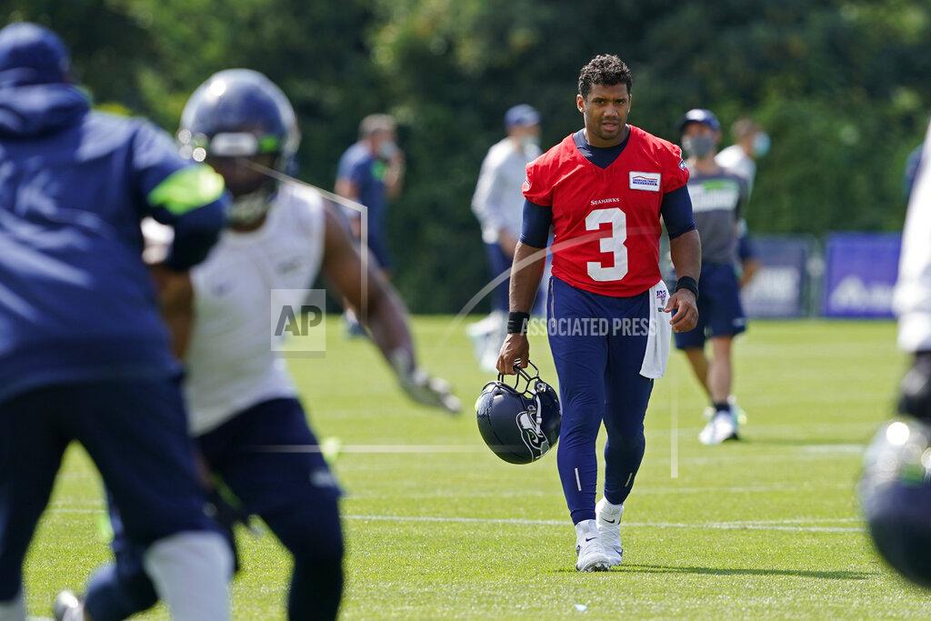 Ted S. Warren Seattle Seahawks quarterback Russell Wilson (3) walks off the field after NFL football training camp, Wednesday, Aug. 12, 2020, in Renton, Wash. (AP Photo/Ted S. Warren)