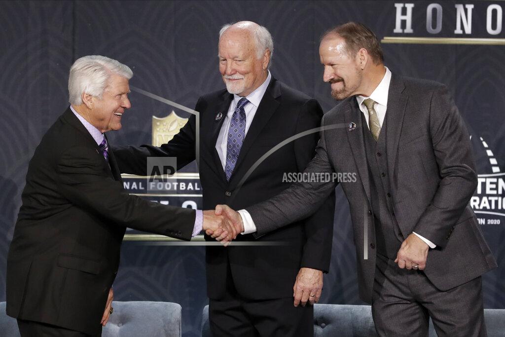Mark Humphrey Hall of Fame Class of 2020, from left, Jimmie Johnson, Chris Harris and Jim Covert at the NFL Honors football award show Saturday, Feb. 1, 2020, in Miami. (AP Photo/Mark Humphrey)