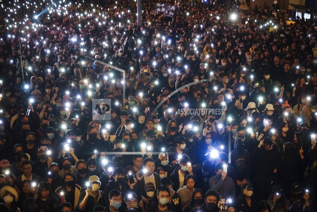 Vincent Yu FILE - In this Sunday, Dec. 8, 2019 file photo, pro-democracy protesters flash their smartphone lights as they gather on a street in Hong Kong. Belarusian opposition figures, Hong Kong-pro-democracy activists, the Black Lives Matter movement, a jailed Russian opposition leader and two former White House senior advisers are among this year’s nominations for the Nobel Peace Prize. The 2021 deadline has passed and some of those who nominated people have spoken up. (AP Photo/Vincent Yu, File)