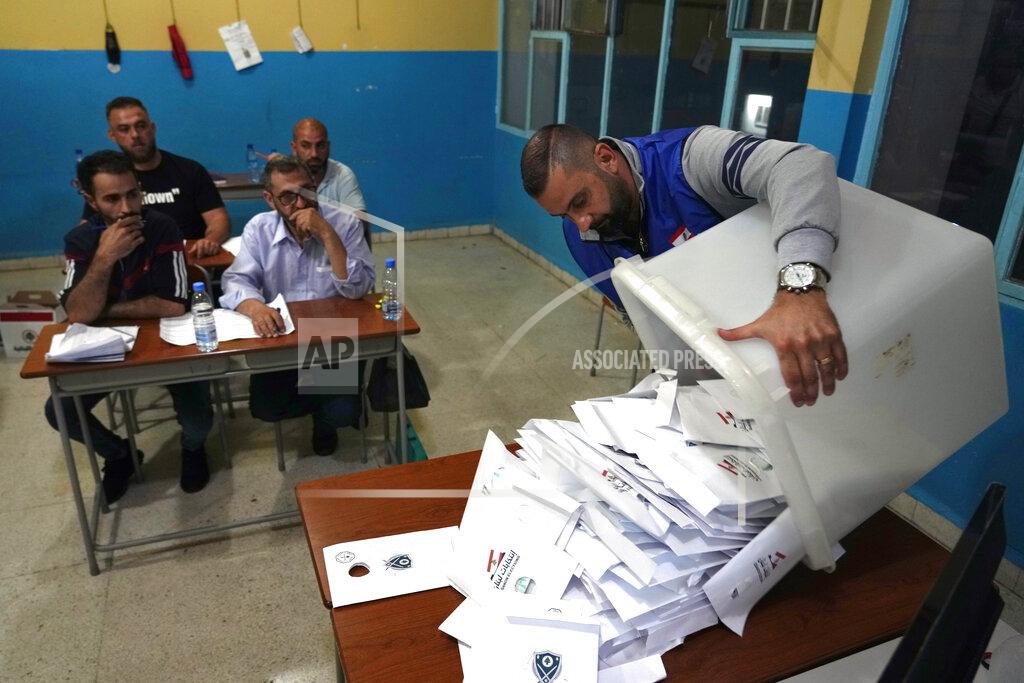 Bilal Hussein Election officials count ballots shortly after polling stations closed, in the northern city of Tripoli, Lebanon, Sunday, May 15, 2022. Lebanese voted for a new parliament Sunday against the backdrop of an economic meltdown that is transforming the country and low expectations that the election would significantly alter the political landscape. (AP Photo/Bilal Hussein)
