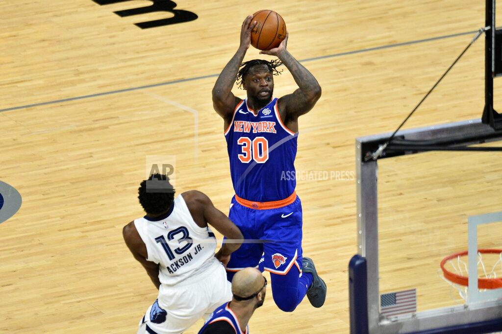 Brandon Dill New York Knicks forward Julius Randle (30) shoots against Memphis Grizzlies forward Jaren Jackson Jr. (13) in the second half of an NBA basketball game Monday, May 3, 2021, in Memphis, Tenn. (AP Photo/Brandon Dill)
