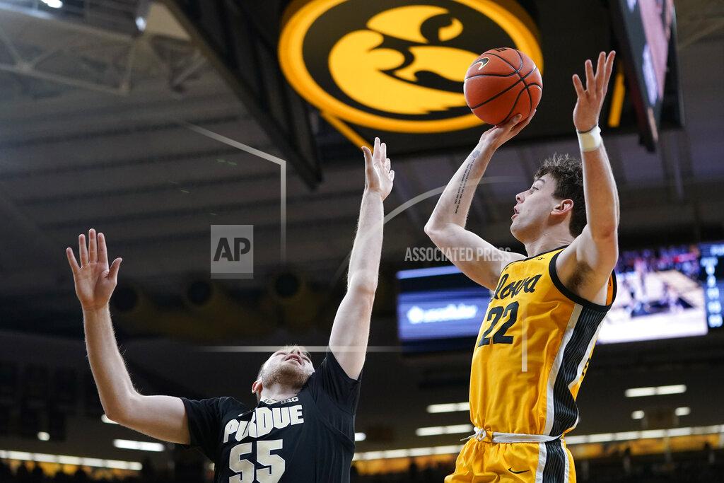 Charlie Neibergall Iowa forward Patrick McCaffery (22) shoots over Purdue guard Sasha Stefanovic (55) during the second half of an NCAA college basketball game, Thursday, Jan. 27, 2022, in Iowa City, Iowa. (AP Photo/Charlie Neibergall)