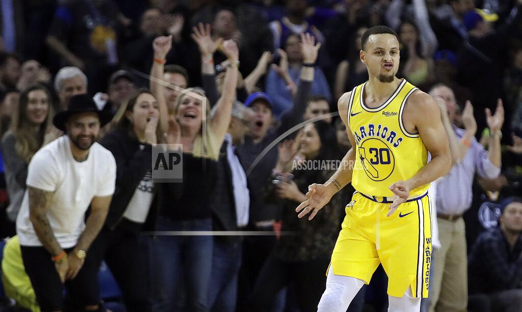 Ben Margot FILE - Golden State Warriors' Stephen Curry celebrates a score against the Sacramento Kings during the second half of an NBA basketball game in Oakland, Calif., in this Thursday, Feb. 21, 2019, file photo. While Golden State is still dealing with the devastating news Splash Brother Klay Thompson will miss another season because of a torn right Achilles tendon that required surgery, everybody is eager for a fresh start. Especially Curry, who played only five games because of a broken left hand. (AP Photo/Ben Margot, File)