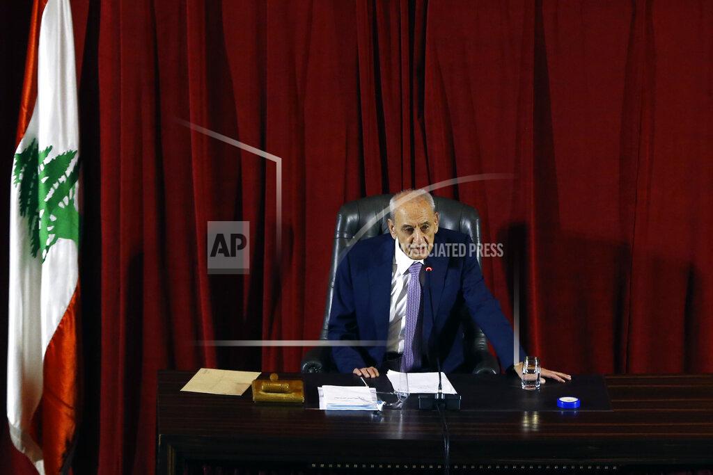 Bilal Hussein Parliament Speaker Nabih Berri speaks during a parliament session to confirm Lebanon's new government at a Beirut theater known as the UNESCO palace so that parliament members could observe social distancing measures imposed over the coronavirus pandemic, Lebanon, Monday, Sept. 20, 2021. A power outage and a broken generator briefly delayed the start of the parliament session for some 40 minutes before electricity came back on. (AP Photo/Bilal Hussein)