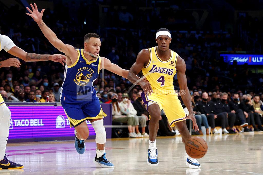 Ringo H.W. Chiu Golden State Warriors guard Stephen Curry (30) defends against Los Angeles Lakers guard Rajon Rondo (4) during the first half of an NBA basketball game in Los Angeles, Tuesday, Oct. 19, 2021. (AP Photo/Ringo H.W. Chiu)