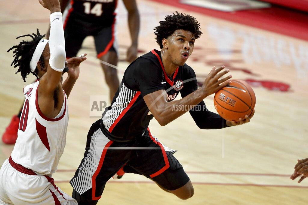 Michael Woods Georgia's Justin Kier (5) drives the hoop against Arkansas during the first half of an NCAA college basketball game Saturday, Jan. 9, 2021, in Fayetteville, Ark. (AP Photo/Michael Woods)