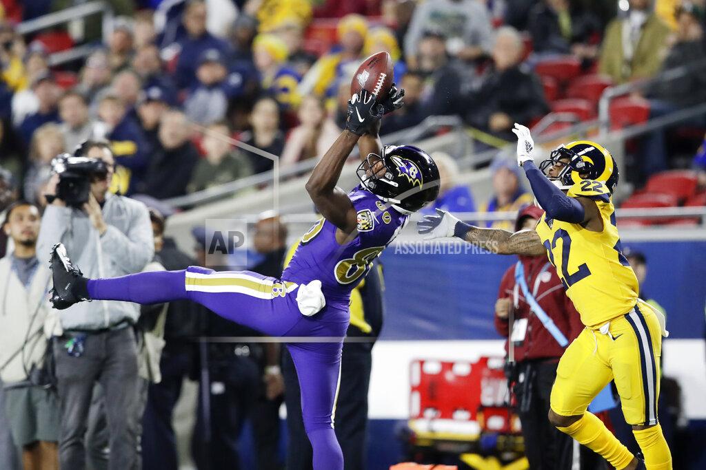 Marcio Jose Sanchez Baltimore Ravens wide receiver Miles Boykin catches a pass in front of Los Angeles Rams cornerback Troy Hill during the second half of an NFL football game Monday, Nov. 25, 2019, in Los Angeles. (AP Photo/Marcio Jose Sanchez)