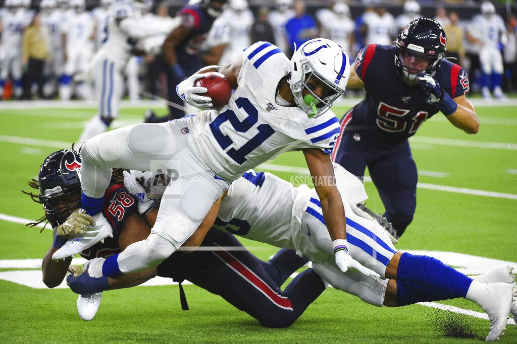 Eric Christian Smith Indianapolis Colts running back Nyheim Hines (21) is upended by Houston Texans linebacker Peter Kalambayi (58) during the first half of an NFL football game Thursday, Nov. 21, 2019, in Houston. (AP Photo/Eric Christian Smith)