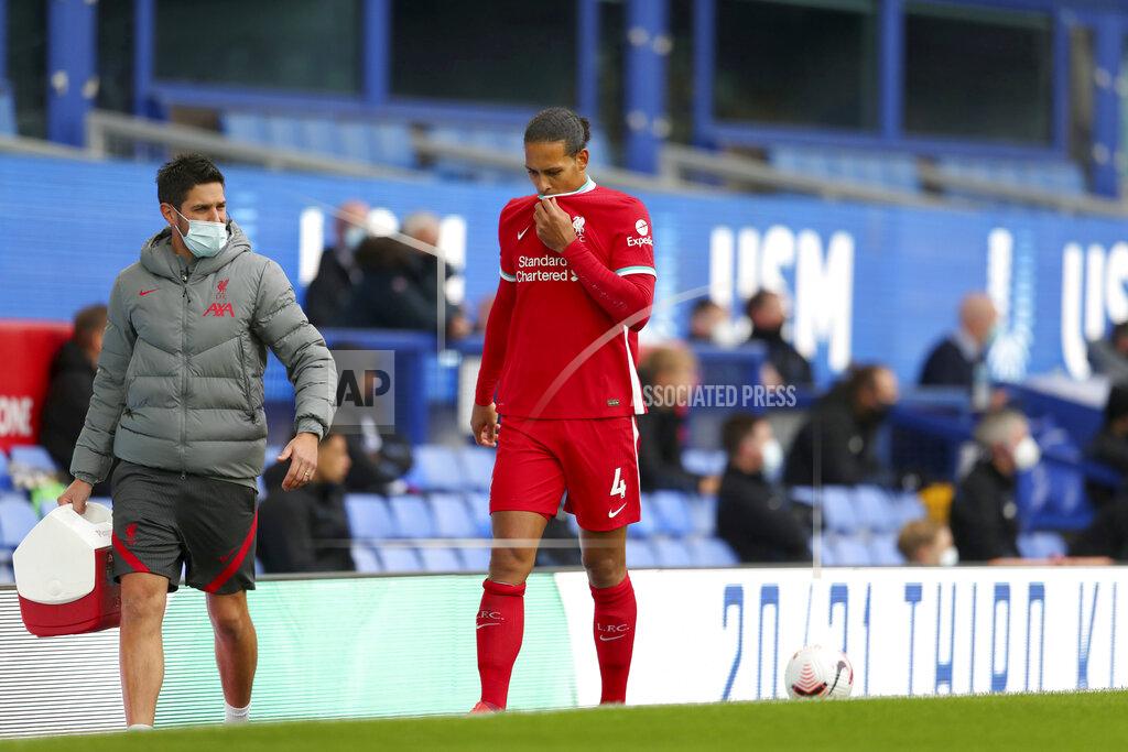 Cath Ivill Liverpool's Virgil van Dijk leaves the match with an injury during the English Premier League soccer match between Everton and Liverpool at Goodison Park stadium, in Liverpool, England, Saturday, Oct. 17, 2020. (Cath Ivill/Pool via AP)