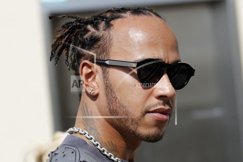Luca Bruno Mercedes driver Lewis Hamilton of Britain arrives at the Yas Marina racetrack in Abu Dhabi, United Arab Emirates, Thursday, Nov. 28, 2018. The Emirates Formula One Grand Prix will take place on Sunday. (AP Photo/Luca Bruno)