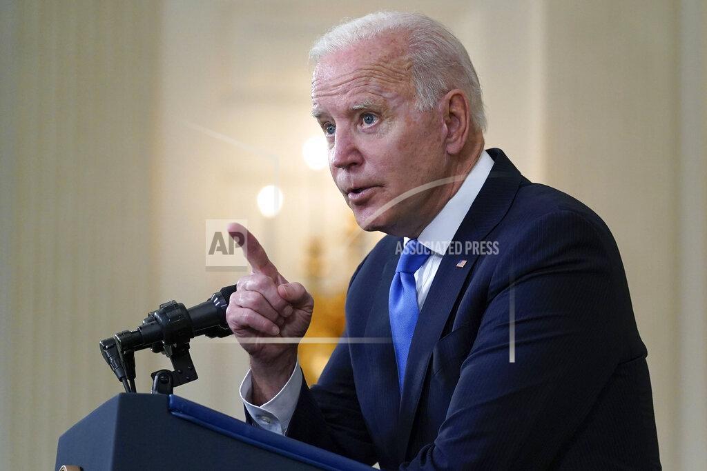 Evan Vucci President Joe Biden gesturing as he takes questions from reporters as he speaks about the American Rescue Plan, in the State Dining Room of the White House, Wednesday, May 5, 2021, in Washington. (AP Photo/Evan Vucci)