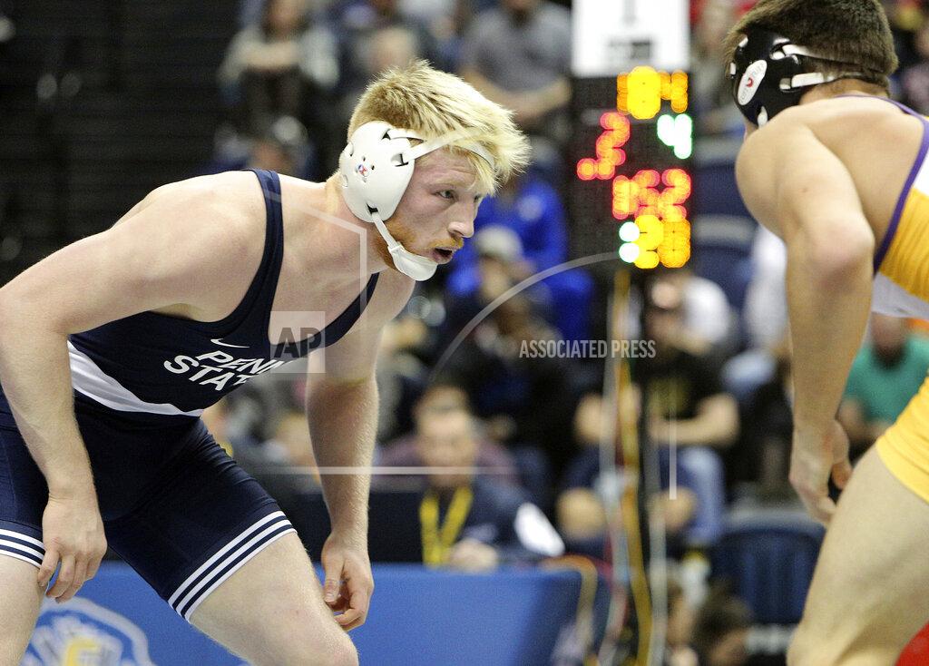 Erin O. Smith FILE - In this Jan. 2, 2018, file photo, Penn State's Bo Nickal, left, faces off with Northern Iowa's Drew Foster at 184 pounds during the Southern Scuffle college wrestling tournament in Chattanooga, Tenn. Penn State seniors Jason Nolf (157 pounds) and Bo Nickal (197) and junior Mark Hall (174) are all expected to return to Happy Valley with national titles. (Erin O. Smith/Chattanooga Times Free Press via AP, File)