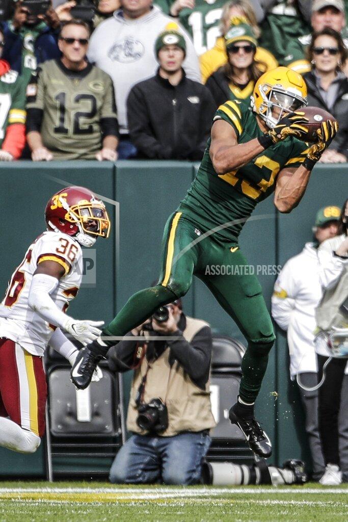 Aaron Gash Green Bay Packers' Allen Lazard catches a touchdown pass in front of Washington Football Team's Danny Johnson during the first half of an NFL football game Sunday, Oct. 24, 2021, in Green Bay, Wis. (AP Photo/Aaron Gash)