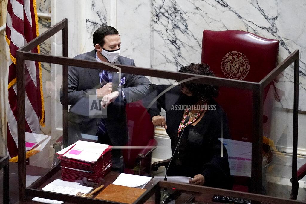 Julio Cortez Maryland Senate President Bill Ferguson, D-Baltimore, left, gives an elbow bump to Senate President Pro Tem Melony Griffith, D-Prince George's County, during the first day of the state's 2021 legislative session, Wednesday, Jan. 13, 2021, in Annapolis, Md. (AP Photo/Julio Cortez)