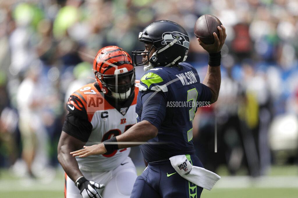 Stephen Brashear Seattle Seahawks quarterback Russell Wilson, right, passes as Cincinnati Bengals defensive tackle Geno Atkins, left, closes in during the first half of an NFL football game Sunday, Sept. 8, 2019, in Seattle. (AP Photo/Stephen Brashear)