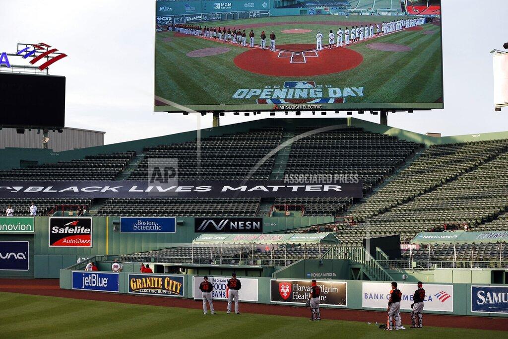 Michael Dwyer A Black Lives Matter banner is displayed in the bleachers during ceremonies before an opening day baseball game between the Boston Red Sox and the Baltimore Orioles at Fenway Park, Friday, July 24, 2020, in Boston. (AP Photo/Michael Dwyer)