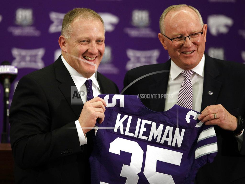 Orlin Wagner Chris Klieman, left, is introduced as the 35th Kansas State NCAA college football head coach by athletic director Gene Taylor, right, in Manhattan, Kan., Wednesday, Dec. 12, 2018. (AP Photo/Orlin Wagner)
