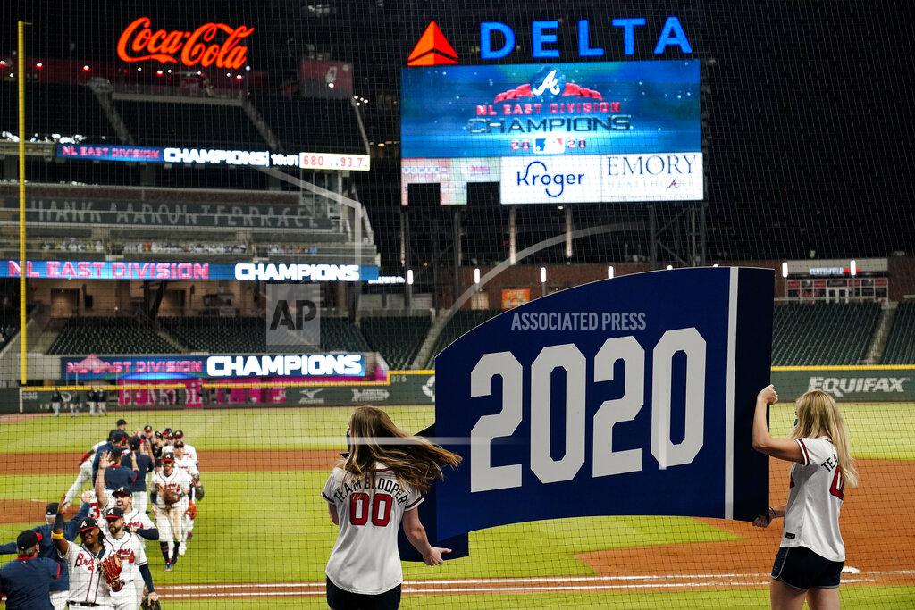 Brynn Anderson The Atlanta Braves celebrate after a baseball game to clinch the NL East title against the Miami Marlins on Tuesday, Sept. 22, 2020, in Atlanta. (AP Photo/Brynn Anderson)