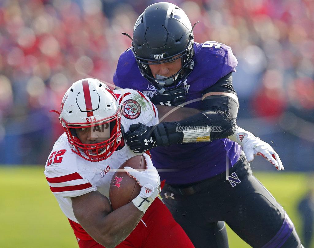Jim Young Nebraska's Devine Ozigbo, left, is tackled by Northwestern's Samdup Miller during the second half of an NCAA college football game, Saturday, Oct. 13, 2018, in Evanston, Ill. (AP Photo/Jim Young)