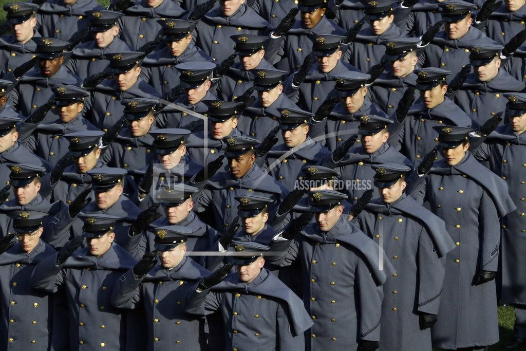 Matt Slocum Army Cadets salute after marching onto the field before an NCAA college football game against Navy, Saturday, Dec. 8, 2018, in Philadelphia. (AP Photo/Matt Slocum)