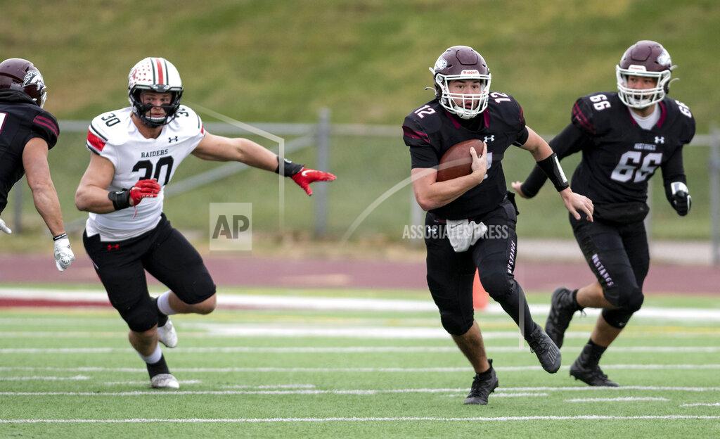 Jesse Brothers FILE - Morningside NCAA college football quarterback Joe Dolincheck carries the ball against Northwestern College in the NAIA semifinals at Elwood Olsen Stadium in Sioux City, Iowa, Saturday, Dec. 4, 2021. Dolincheck led a group of Morningside College seniors that climbed Pike's Peak this summer. He'll try to lead them back to the mountaintop of NAIA football this fall. (Jesse Brothers/Sioux City Journal via AP, File)