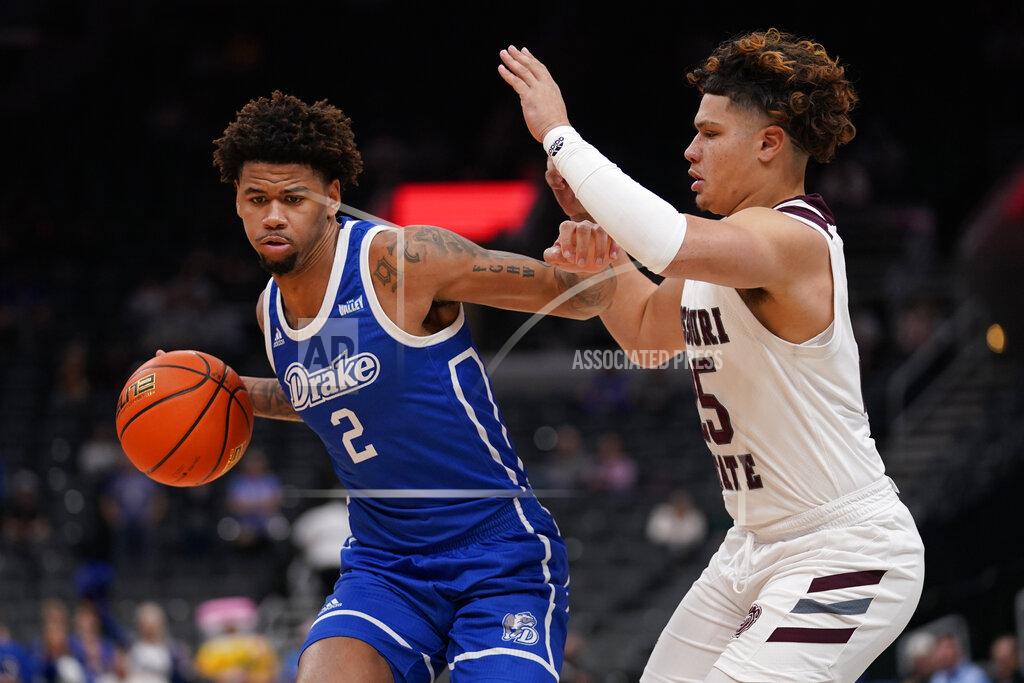 Jeff Roberson Drake's Tremell Murphy (2) brings the ball down the court as Missouri State's Lu'Cye Patterson defends during the first half of an NCAA college basketball game in the semifinal round of the Missouri Valley Conference tournament Saturday, March 5, 2022, in St. Louis. (AP Photo/Jeff Roberson)