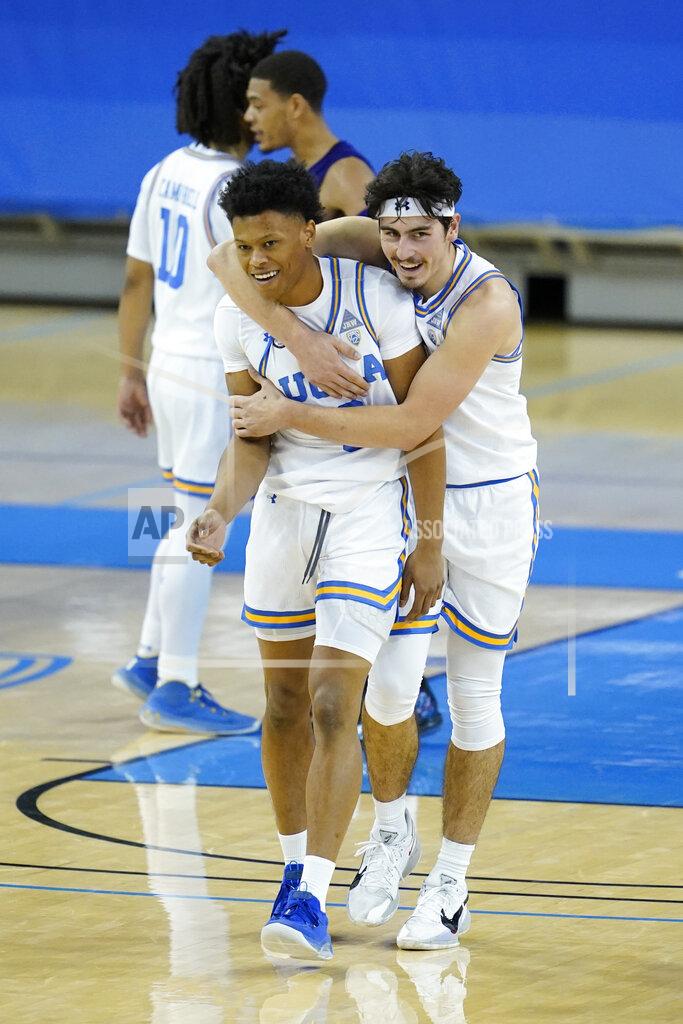 Ashley Landis UCLA guard Jaylen Clark, front left, and guard Jaime Jaquez Jr., right, celebrate their win over Washington after an NCAA college basketball game Saturday, Jan. 16, 2021, in Los Angeles. (AP Photo/Ashley Landis)