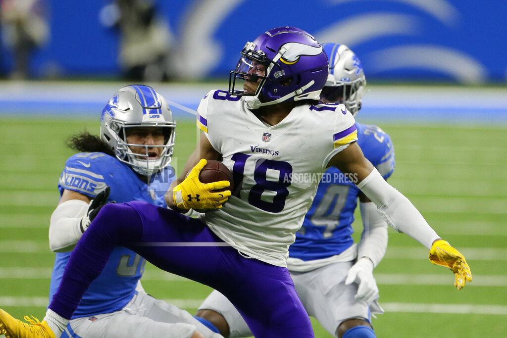 Duane Burleson Minnesota Vikings wide receiver Justin Jefferson (18) makes a catch as Detroit Lions outside linebacker Jahlani Tavai, left, and cornerback Amani Oruwariye (24) defend during the first half of an NFL football game, Sunday, Jan. 3, 2021, in Detroit. (AP Photo/Duane Burleson)
