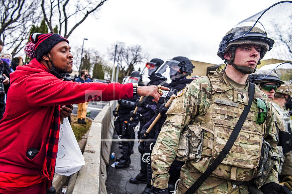 Richard Tsong-Taatarii Protesters confronted police over the shooting death of Daunte Wright at a rally at the Brooklyn Center Police Department in Brooklyn Center, Minn., Monday, April 12, 20121. (Richard Tsong-Taatarii/Star Tribune via AP)