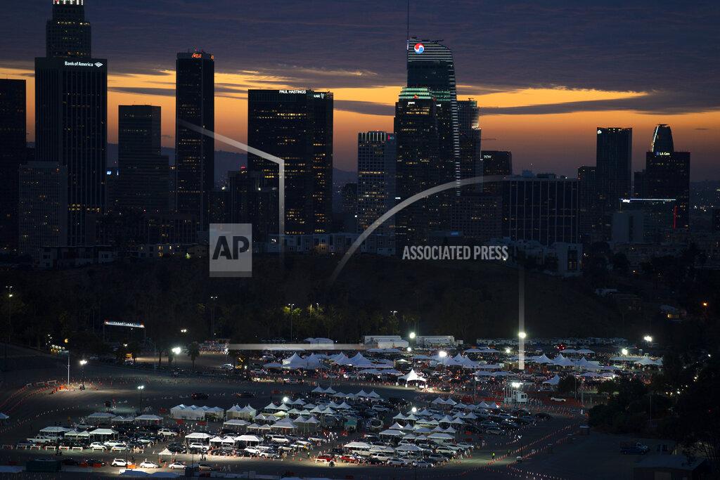 Jae C. Hong FILE - In this Jan. 27, 2021, file photo, motorists line up for COVID-19 vaccinations and testing in the parking lot of Dodger Stadium in Los Angeles. Los Angeles County, which is home to a quarter of the state's 40 million people and has endured a disproportionate number of deaths, didn't record a single COVID-19 death on Sunday, May 2. (AP Photo/Jae C. Hong, File)