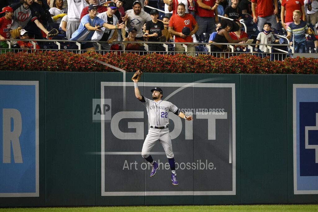 Nick Wass Colorado Rockies left fielder Sam Hilliard (22) makes a catch on a ball hit by Washington Nationals' Yadiel Hernandez for the out during the fourth inning of a baseball game Friday, Sept. 17, 2021, in Washington. (AP Photo/Nick Wass)