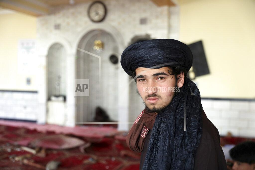 Rahmat Gul Religious student poses for photograph inside a mosque after a bomb explosion in Shakar Dara district of Kabul, Afghanistan, Friday, May 14, 2021. A bomb ripped through a mosque in northern Kabul during Friday prayers killing 12 worshippers, Afghan police said. (AP Photo/Rahmat Gul)