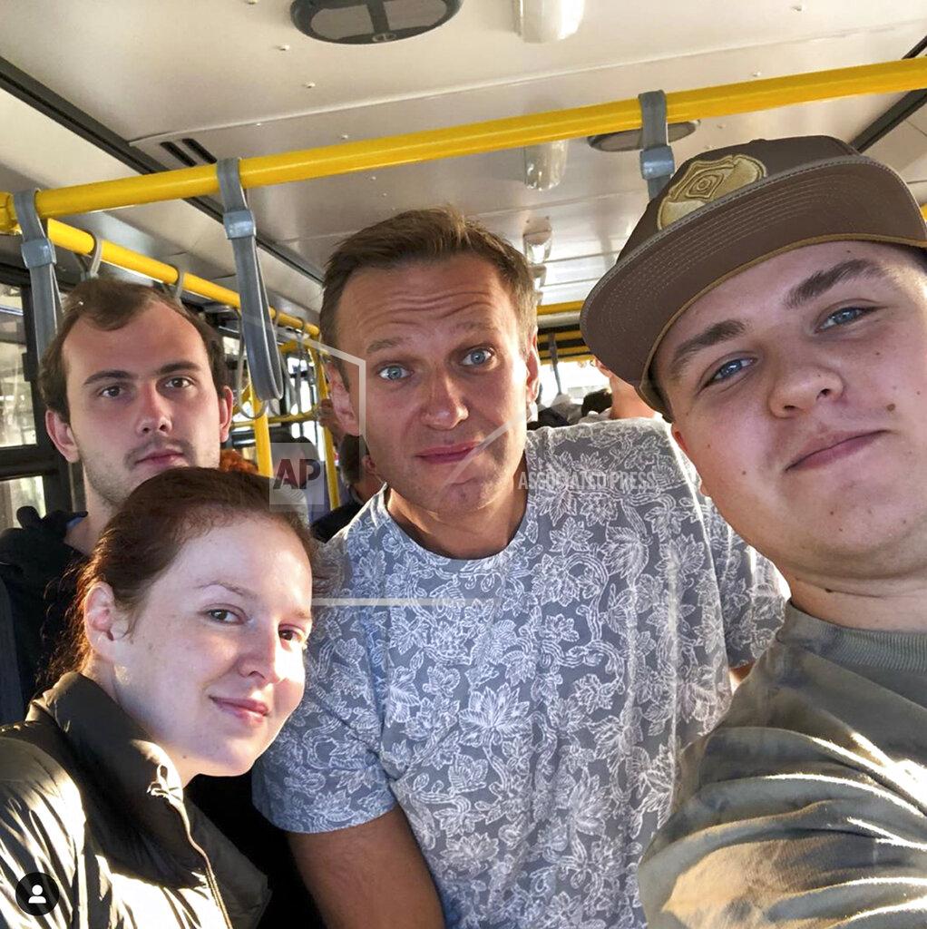 Gluchinskiy In this handout photo taken provided gluchinskiy, Russian opposition leader Alexei Navalny, center, and Kira Yarmysh, foreground left, pose for a selfie inside a bus on their way to an aircraft at an airport outside Tomsk, a city in Siberia, Russia Thursday, Aug. 20, 2020. Russian opposition leader Alexei Navalny is in a coma in a hospital in Siberia after falling ill from a suspected poisoning. His spokeswoman said Navalny felt unwell on a flight to Moscow and the plane made an emergency landing. (gluchinskiy via AP)