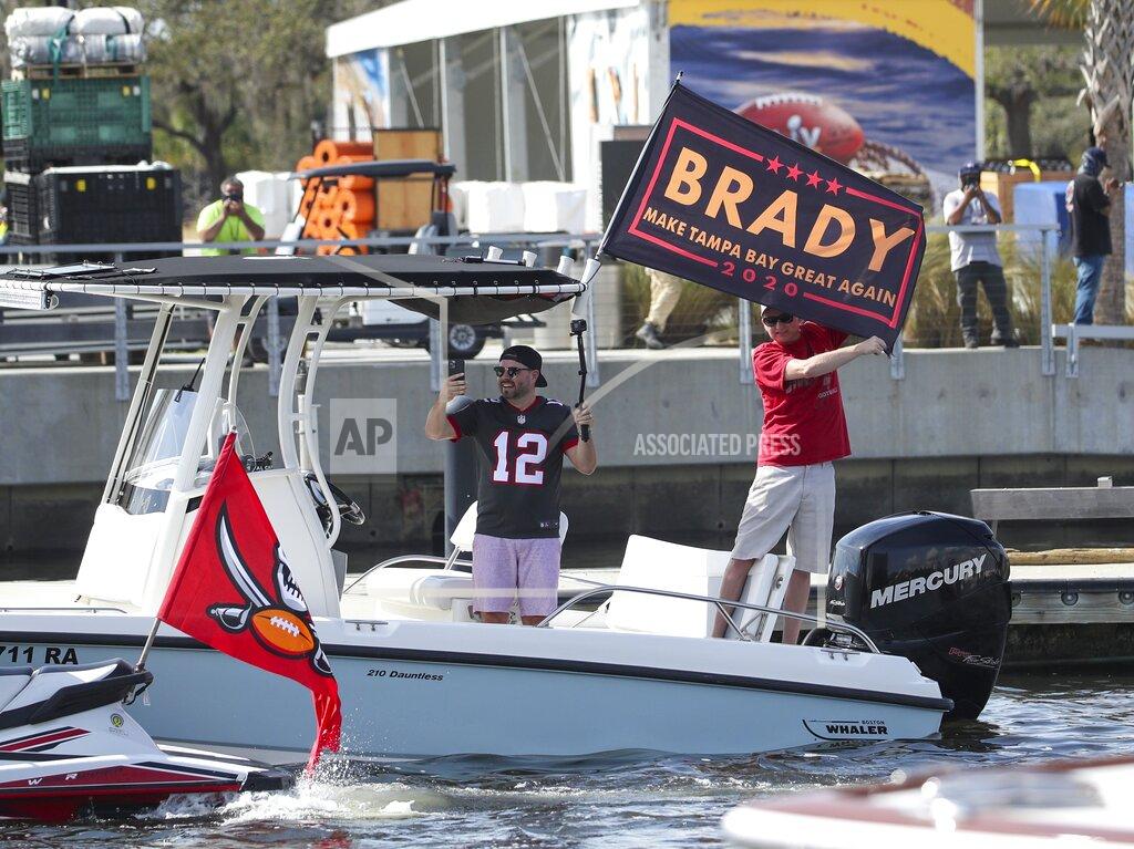 Dirk Shadd Tampa Bay Buccaneers fans follow a boat parade celebrating their Super Bowl 55 victory over the Kansas City Chiefs in Tampa, Fla., Wednesday, Feb. 10, 2021. (Dirk Shadd/Tampa Bay Times via AP)