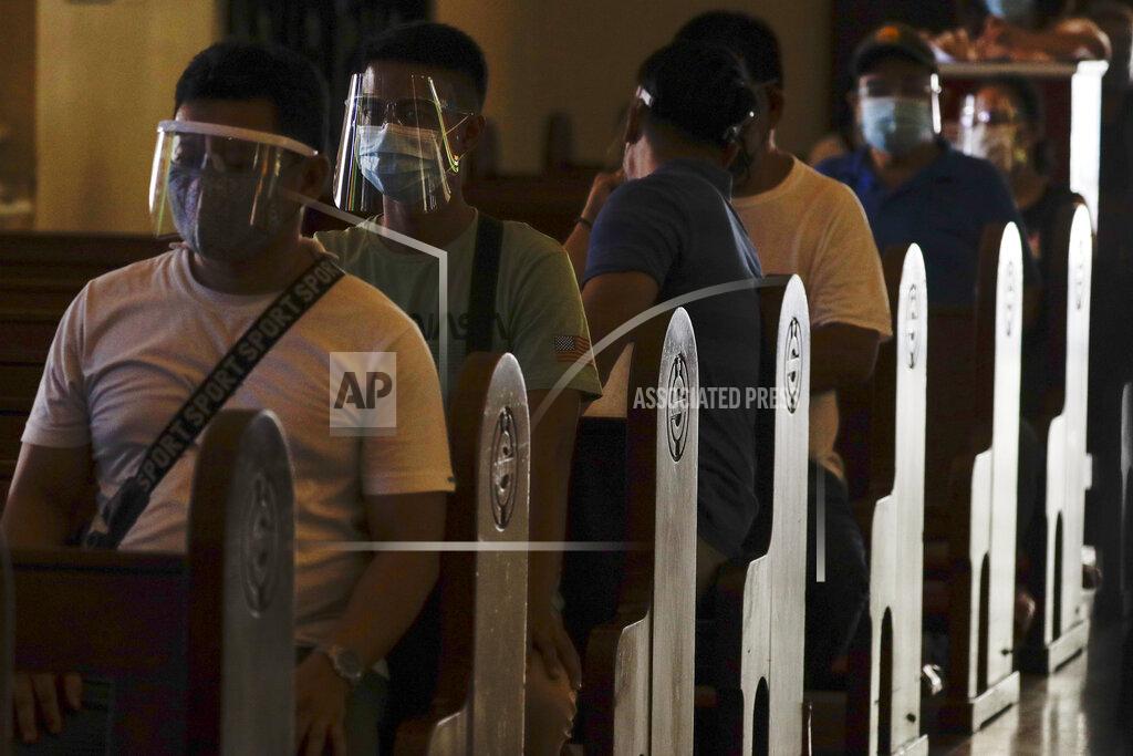 Aaron Favila Residents wait to be inoculated with the AstraZeneca COVID-19 vaccine inside the Sacred Heart of Jesus Parish church in Quezon City, Philippines on Monday, May 17, 2021. The church was used to speed up the vaccination process to residents in the area. (AP Photo/Aaron Favila)
