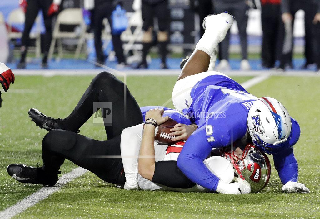 Mark Humphrey Middle Tennessee defensive tackle Jordan Ferguson (91) lands on Western Kentucky quarterback Steven Duncan after Duncan was sacked for a 7-yard loss during the second half of an NCAA college football game Friday, Nov. 2, 2018, in Murfreesboro, Tenn. Middle Tennessee won 29-10. (AP Photo/Mark Humphrey)
