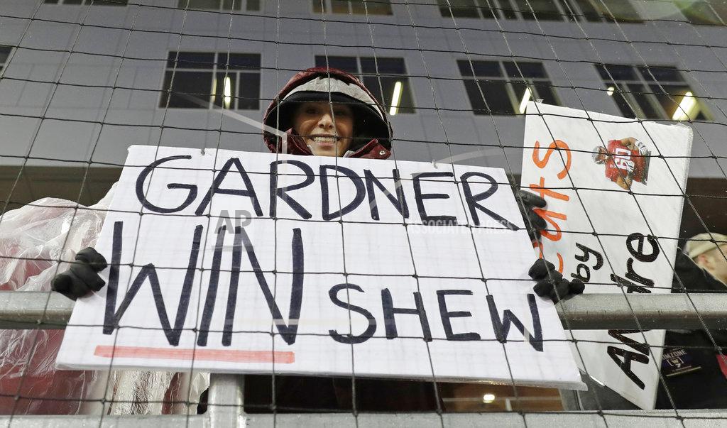Ted S. Warren A Washington State fan holds a sign in tribute to quarterback Gardner Minshew before an NCAA college football game against Washington, Friday, Nov. 23, 2018, in Pullman, Wash. (AP Photo/Ted S. Warren)