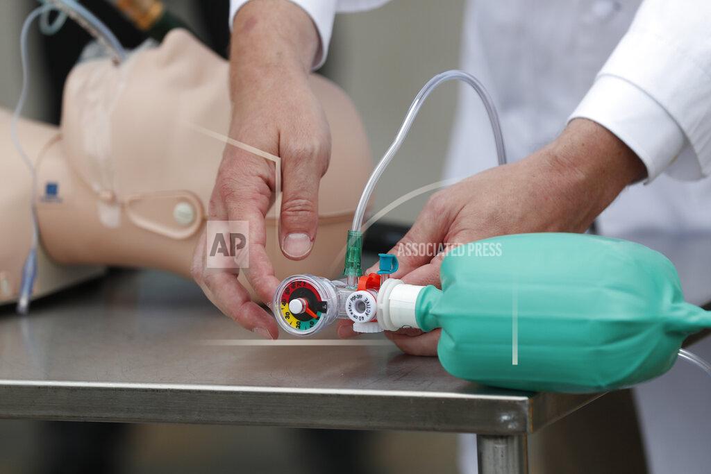 Rogelio V. Solis Dr. Charles Robertson, an assistant professor of anesthesiology at the University of Mississippi Medical Center demonstrates how the simple "last resort" ventilator he and a group of pediatric nurses and physicians designed and built, operates in Jackson, Miss., Tuesday, April 7, 2020. The group has built and tested 170 Robertson Ventilators made of items such as tubing, garden hose, and a digital timer found at local hardware stores. The medical school hopes to fast track approval by the U.S. Food and Drug Administration so they can be put into use should they be needed. (AP Photo/Rogelio V. Solis)