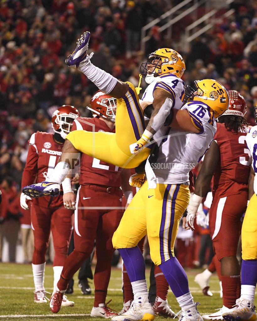 Michael Woods LSU running back Nick Brossette celebrates with teammate Austin Deculus after scoring a touchdown in the first half of an NCAA college football game against Arkansas, Saturday, Nov. 10, 2018, in Fayetteville, Ark. (AP Photo/Michael Woods)