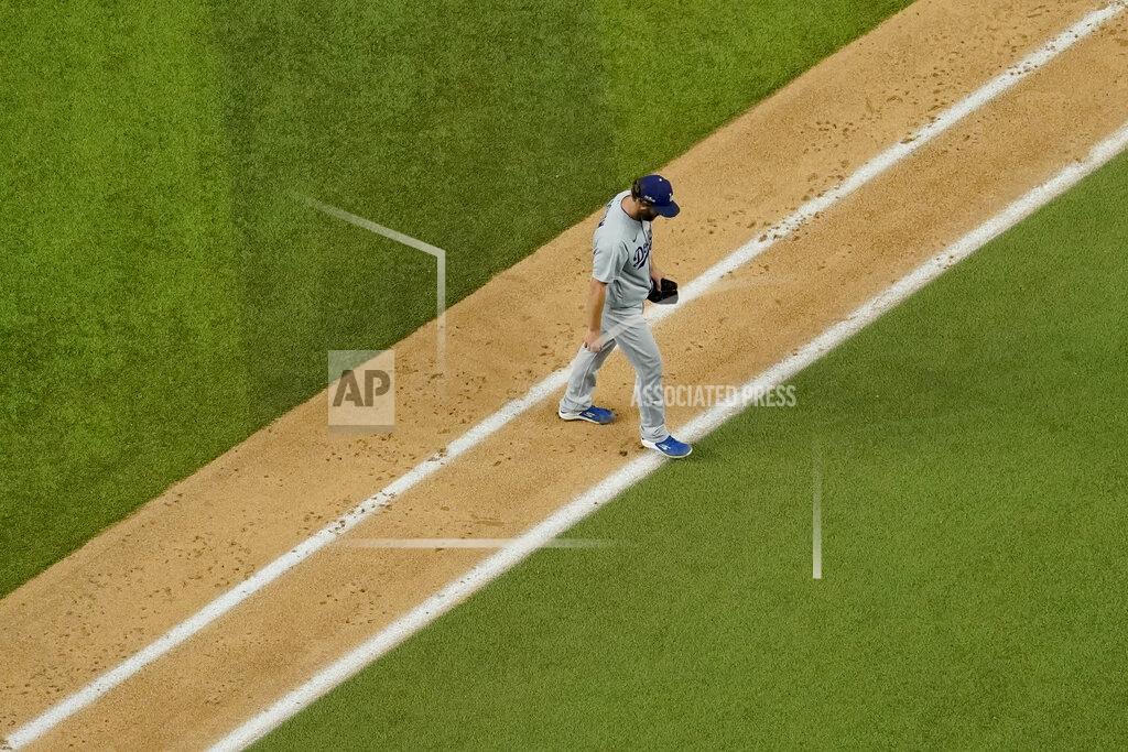 David J. Phillip Los Angeles Dodgers starting pitcher Clayton Kershaw (22) leaves the game against the Atlanta Braves during the sixth inning in Game 4 of a baseball National League Championship Series Thursday, Oct. 15, 2020, in Arlington, Texas. (AP Photo/David J. Phillip)