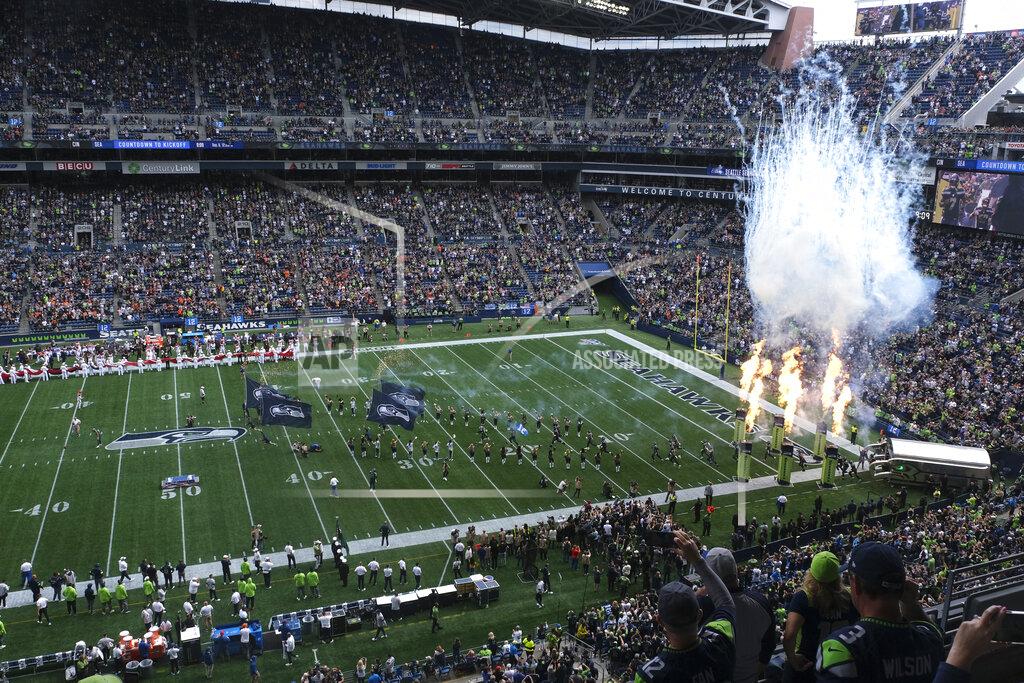 Stephen Brashear Fire effects go off as Seattle Seahawks players run out of the tunnel at the start of their home opener NFL football game against the Cincinnati Bengals at CenturyLink Field, Sunday, Sept. 8, 2019, in Seattle. (AP Photo/Stephen Brashear)