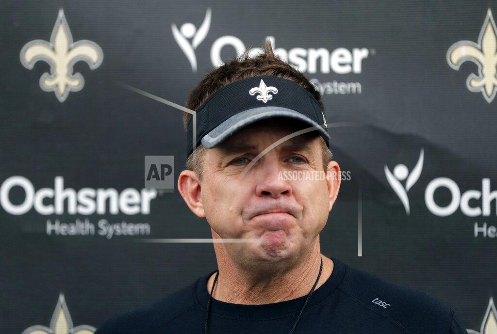 FILE - In this Jan. 18, 2019, file photo, New Orleans Saints head coach Sean Payton talks to reporters after NFL football practice in Metairie, La. Payton said Wednesday, Jan. 30, 2019, that he turned to ice cream, binge-watching and seclusion after his team’s football season game to an excruciating end. (AP Photo/Gerald Herbert, File)
