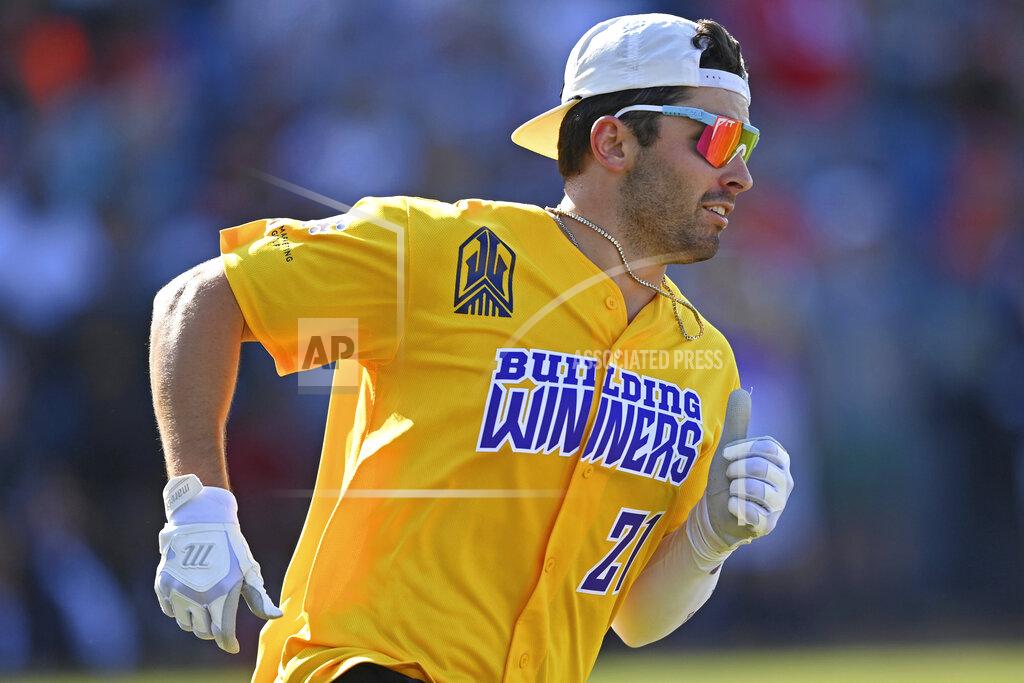David Dermer Cleveland Browns quarterback Baker Mayfield runs after a hit during the Jarvis Landry Celebrity Softball game Saturday, June 12, 2021, in Eastlake, Ohio. (AP Photo/David Dermer)