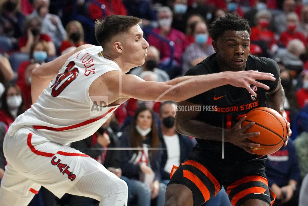 Rick Scuteri Oregon State guard Dashawn Davis drives on Arizona forward Azuolas Tubelis (10) during the first half of an NCAA college basketball game Thursday, Feb. 17, 2022, in Tucson, Ariz. (AP Photo/Rick Scuteri)