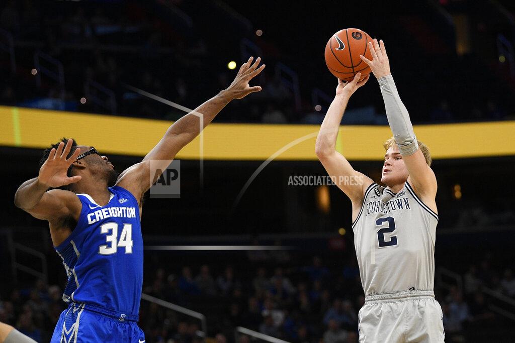 Nick Wass Georgetown guard Mac McClung (2) shoots as he is defended by Creighton guard Denzel Mahoney (34) during the second half of an NCAA college basketball game, Wednesday, Jan. 15, 2020, in Washington. Georgetown won 83-80. (AP Photo/Nick Wass)